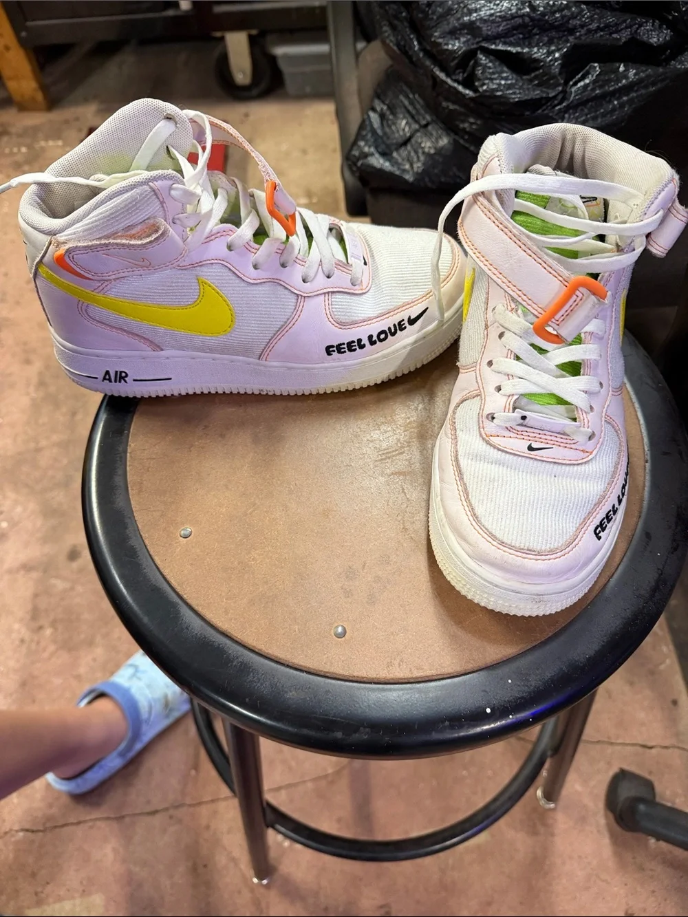 Nike women’s White and Pink High-Top Sneakers with Lime and Orange Accents